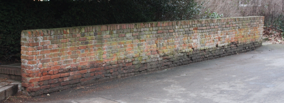The only surviving wall of the fives court. This particular court was reserved for the use of prefects, consequently all other boys were forbidden to cross the court, so had to walk behind the wall. This tradition survived at least until the 1940s even though the court and wall had long lost their original purpose.